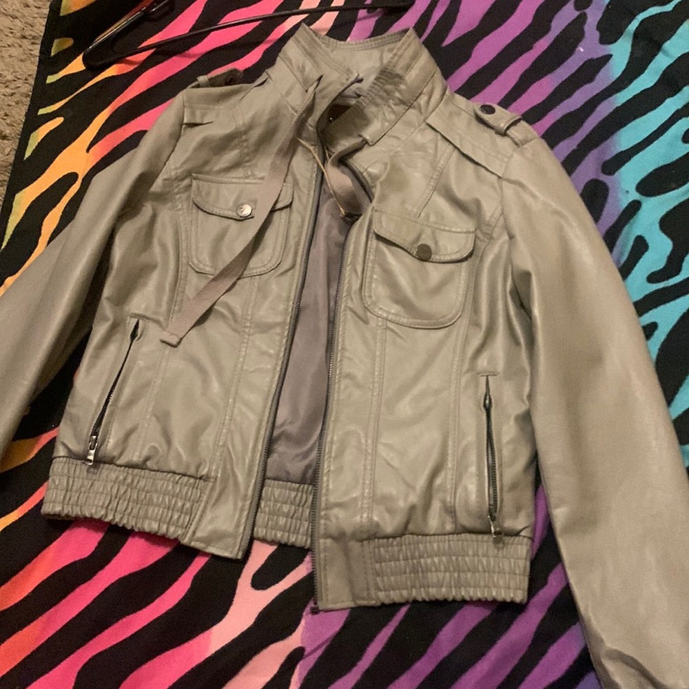 This is a greenish color jacket nice color and cute .